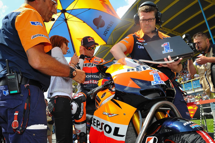Stoner wins as Lorenzo crashes